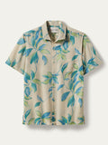 Beige short-sleeve shirt with blue and green leaf print, Flat lay front view.