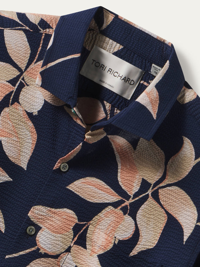 Navy shirt with peach and cream floral print, button-up front view; leaf floral pattern shown.