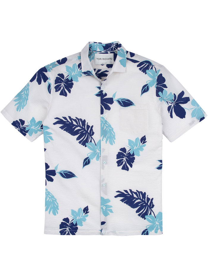 White shirt, blue/teal leaf print, short sleeves, front pocket, button-down (front view).