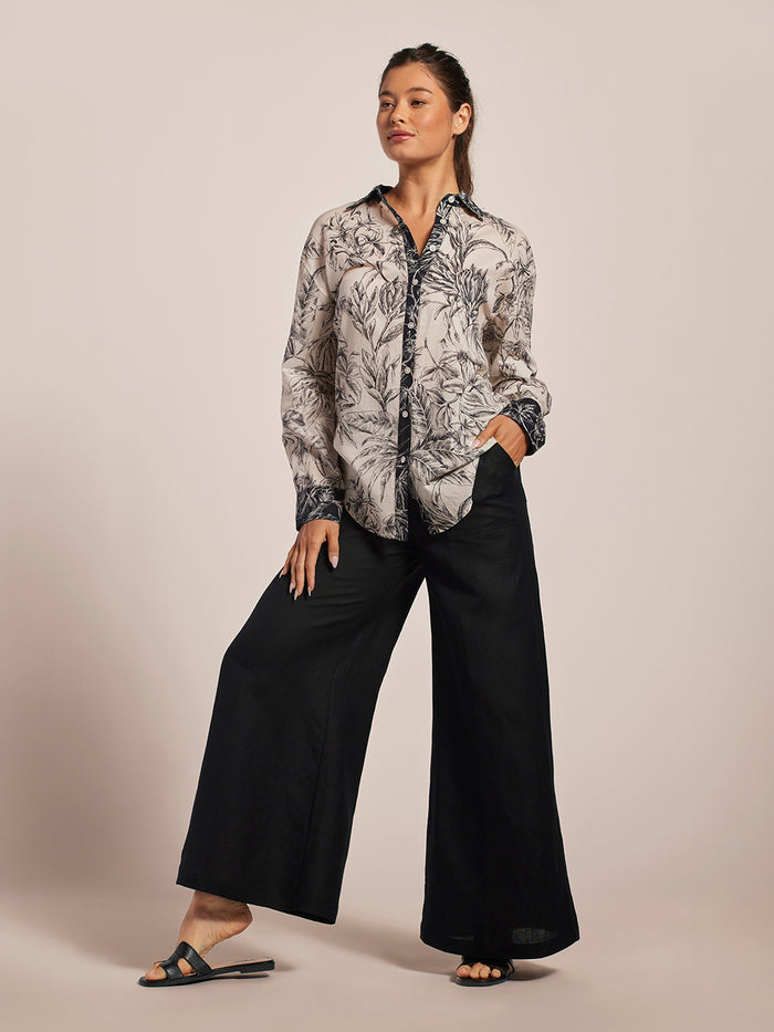 Ivory oversized Laila top, black wide-leg pants, and sandals—full and front outfit views.
