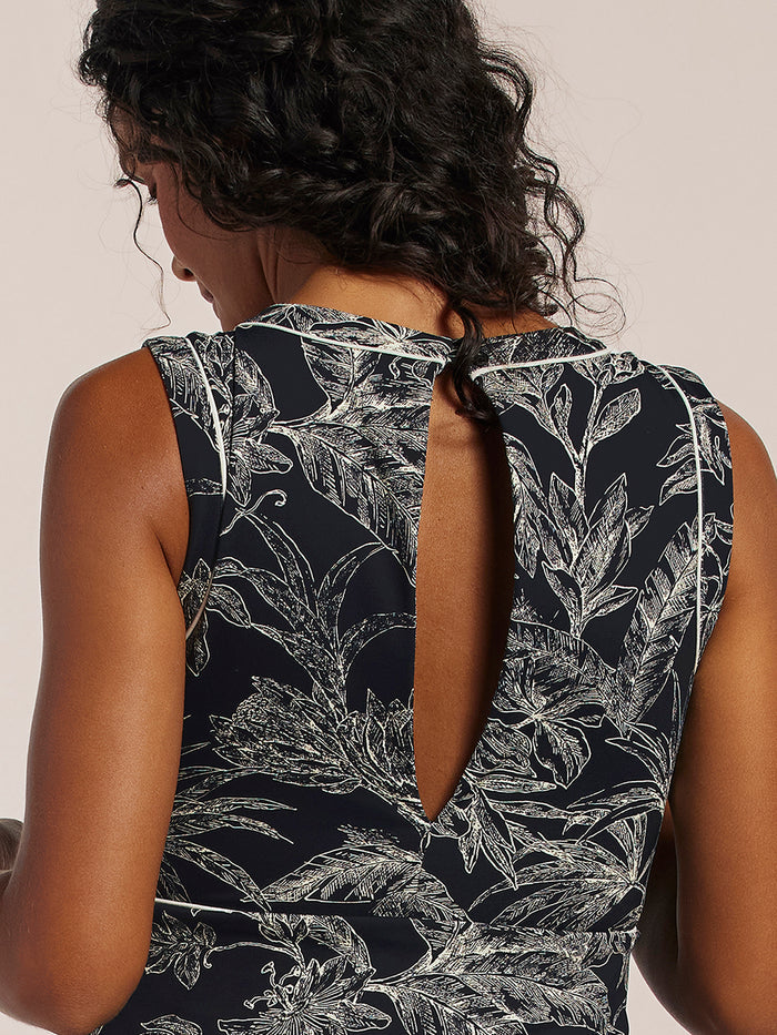 Dark with white floral print sleeveless romper, front view, back keyhole detail shown.