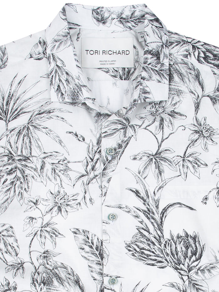 White cotton lawn Hawaiian shirt with black botanical print, front view.
