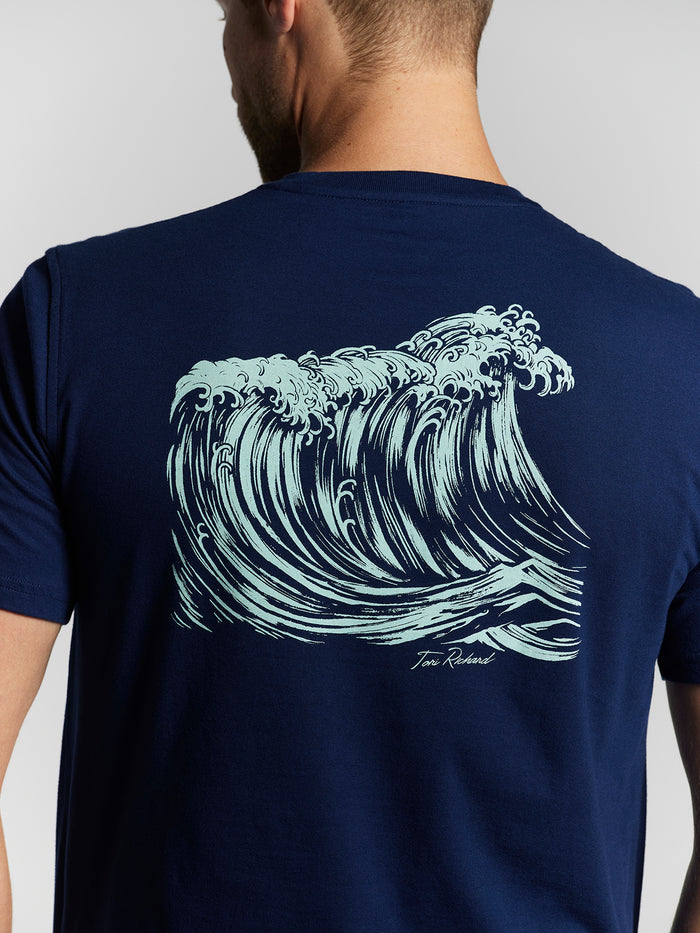 Navy T-shirt with light blue Japanese wave print and Tom Roland signature on back, front and back views.
