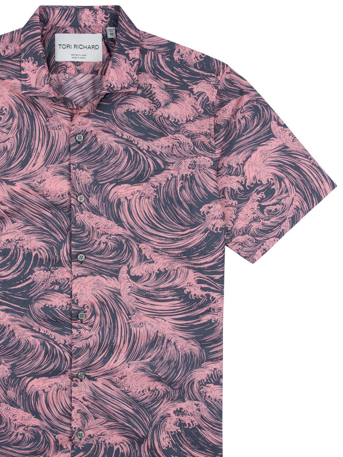 Dark cotton short-sleeve shirt with pink wave pattern or print, shown from front view.