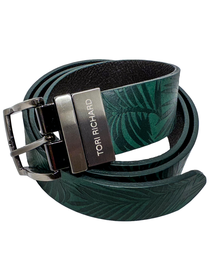 Dark green leaf-pattern Italian leather reversible belt with zinc buckle and silver Tori Richard label, front view.
