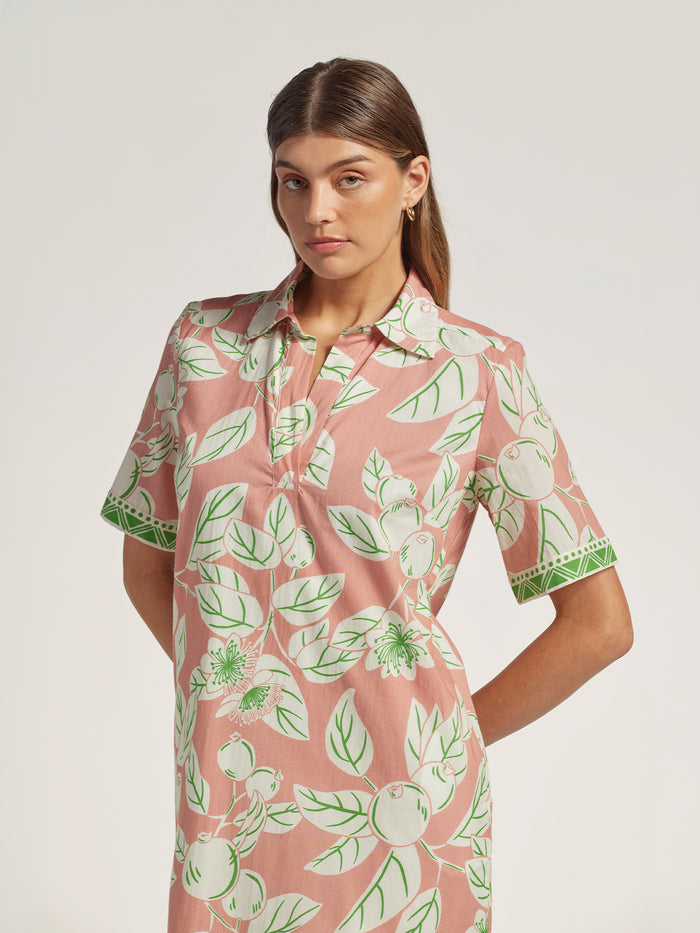 Green and white fruit-and-leaf print cotton voile dress, front and three-quarter views.