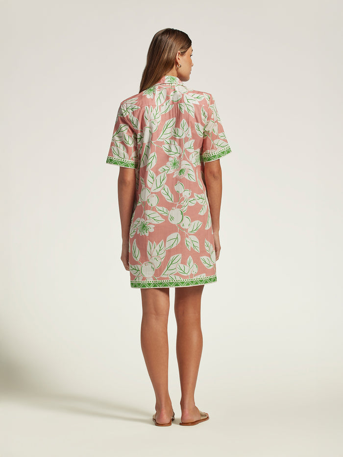 Pink floral cotton voile dress with green trim, back view.