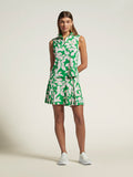 Green and white leaf-print Guava Grove Noa top, front view, paired with white sneakers.