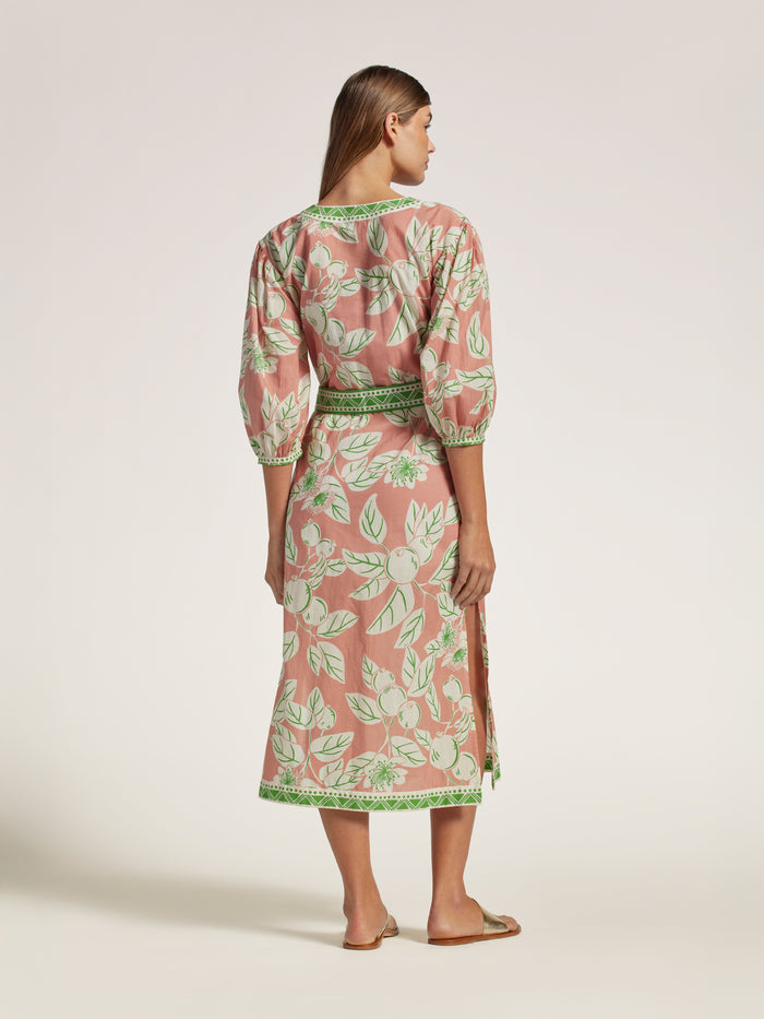 Green and pink floral-print caftan dress with sash waist tie, back view showing side slit.