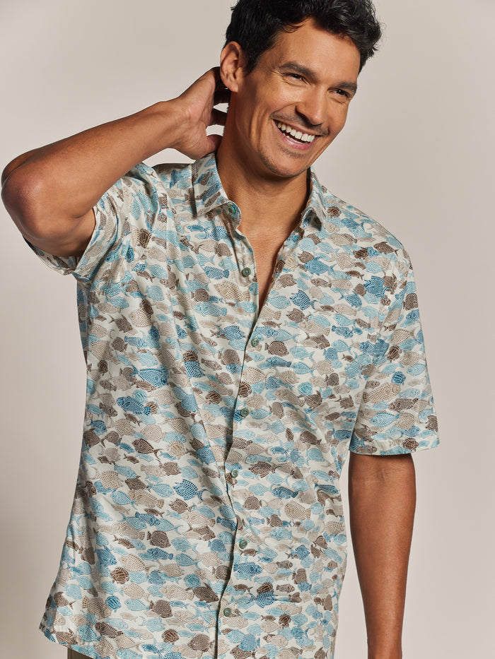 Off-White Hawaiian and blue/brown fish-print cotton short-sleeve Hawaiian shirt, man front view.