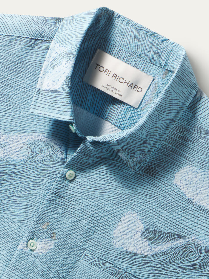 Light blue, cloud-print polyester shirt, short sleeves lightweight polyester with UPF.