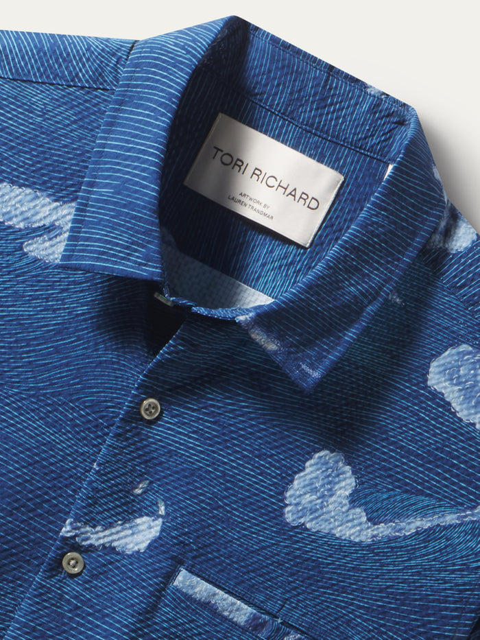 Blue solid short-sleeve shirt, close-up of collar with Tori Richard label and UPF detail.