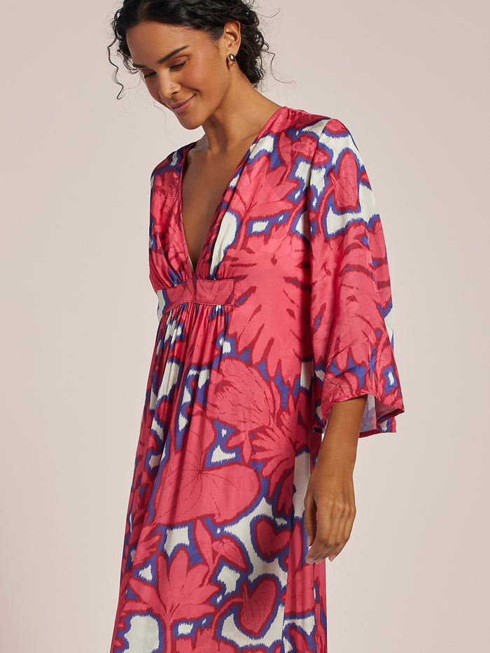 Multicolor ikat-print midi caftan dress with deep V-neckline, front view.