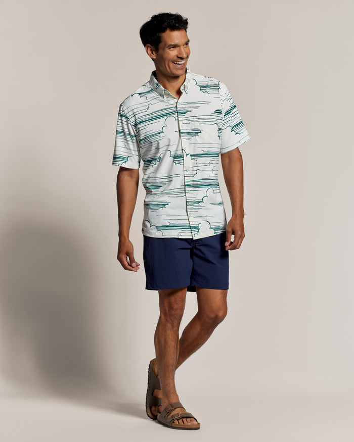 Light blue UPF long-sleeve shirt and navy shorts, front view shown in both images.