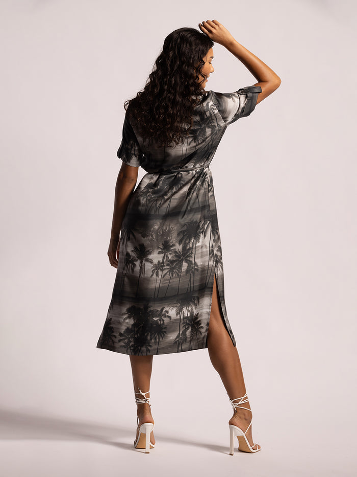 Black and gray palm tree-print midi dress with side slit, front view show.