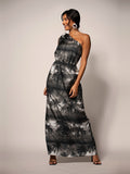 Black and gray palm-print dress, front view, worn by woman against plain background.