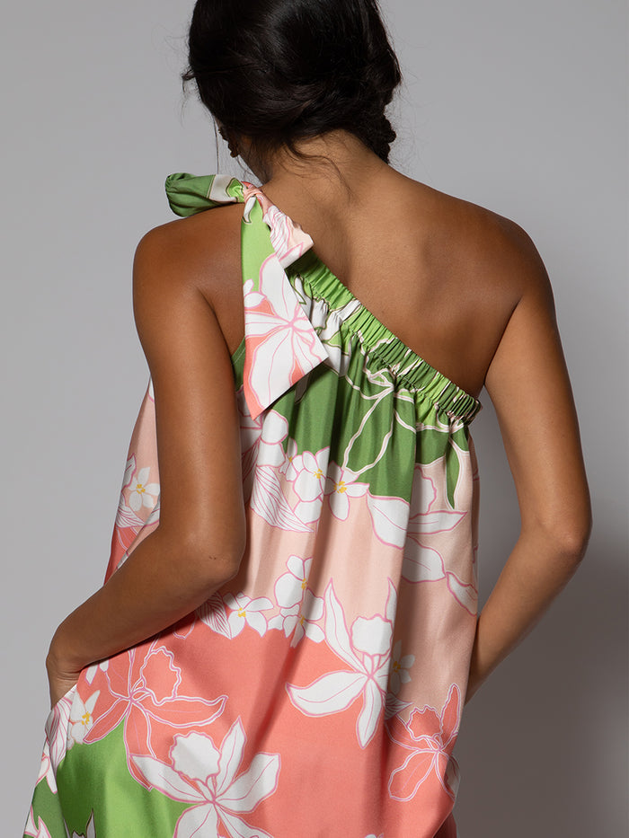 White, knee-length, sleeveless dress with subtle texture, with floral print pink, green Hawaiian maxi dress in pink, green, and white shown full and front view on model.