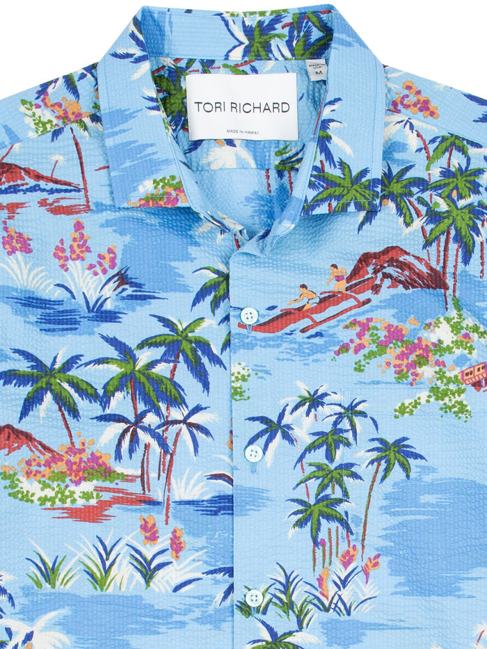 Blue outrigger canoe and palm print cotton shirt, front view.
