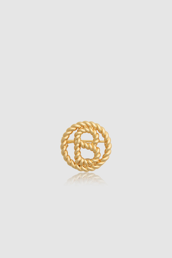 interlock pin brooch in gold by buttonscarves front view