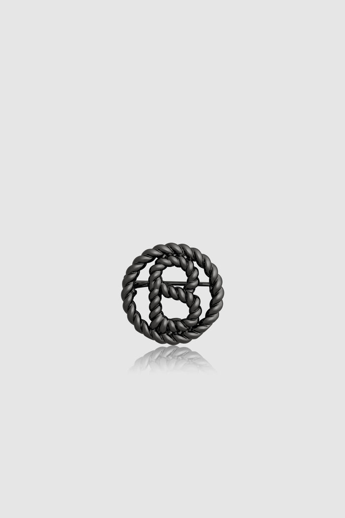 interlock pin brooch in hematite by buttonscarves front view