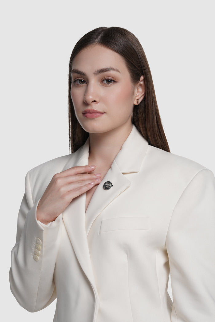 interlock pin brooch in hematite by buttonscarves on blazer