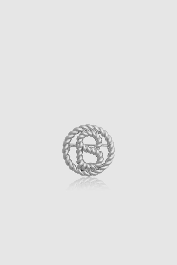 interlock pin brooch in silver by buttonscarves front view