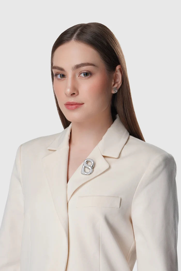 silver isla brooch pinned to clothing