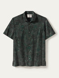Dark green and black geometric-print short-sleeve button-up shirt, front view (Images 1 & 2).