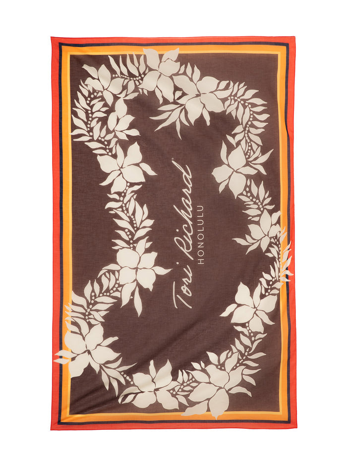 Brown cotton scarf with cream floral lei design.