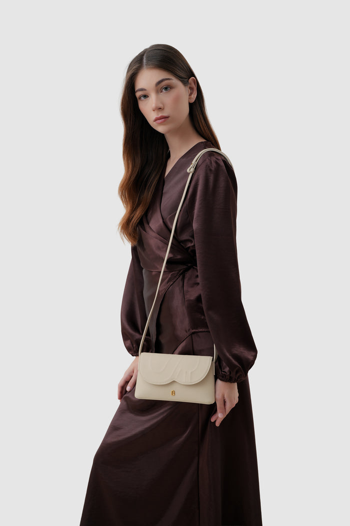 jenny sling bag in beige by buttonscarves with adjustable leather strap