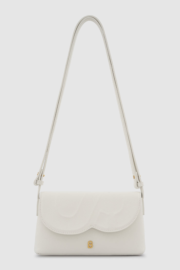 jenny sling bag in broken white by buttonscarves front view