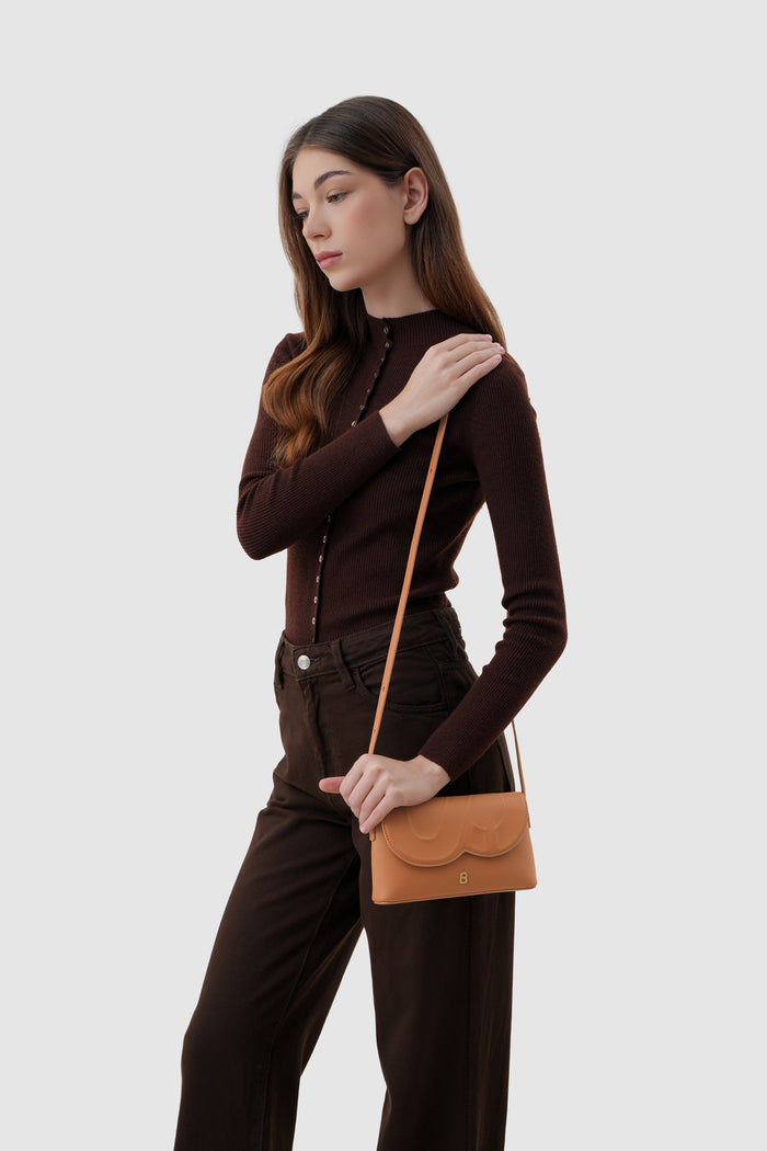 jenny sling bag in tan by buttonscarves with adjustable leather strap