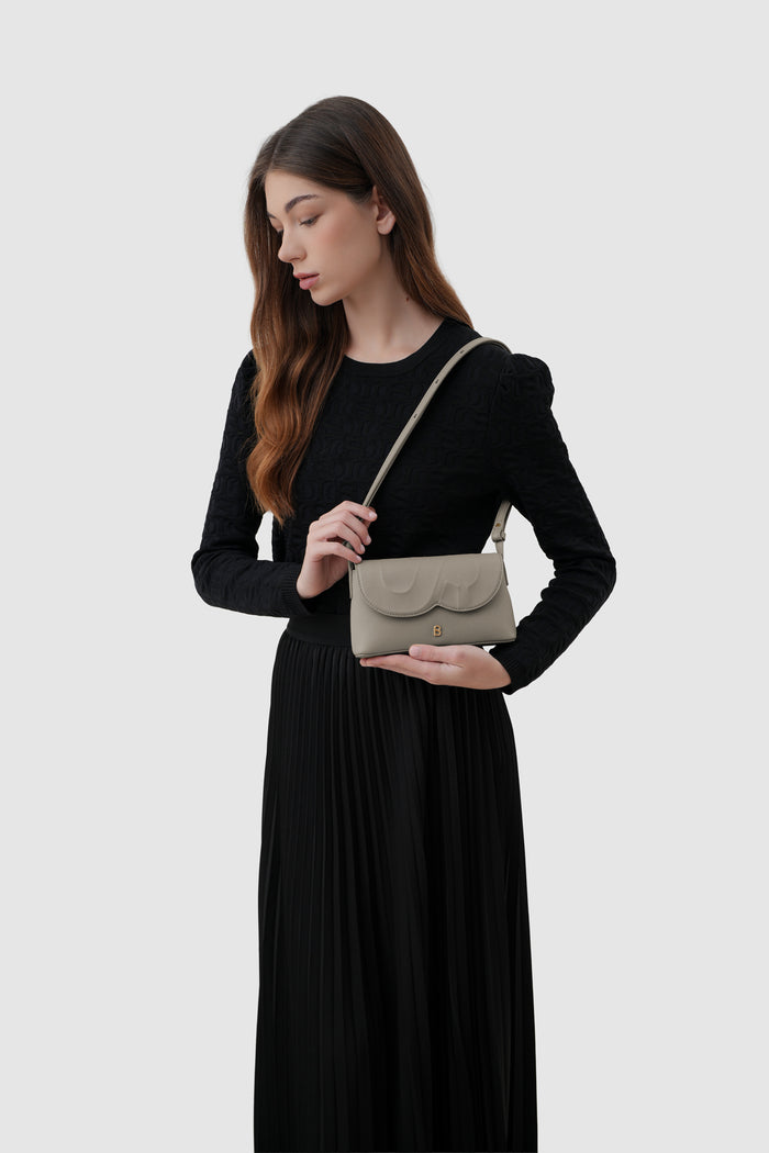 jenny sling bag in taupe by buttonscarves on shoulder