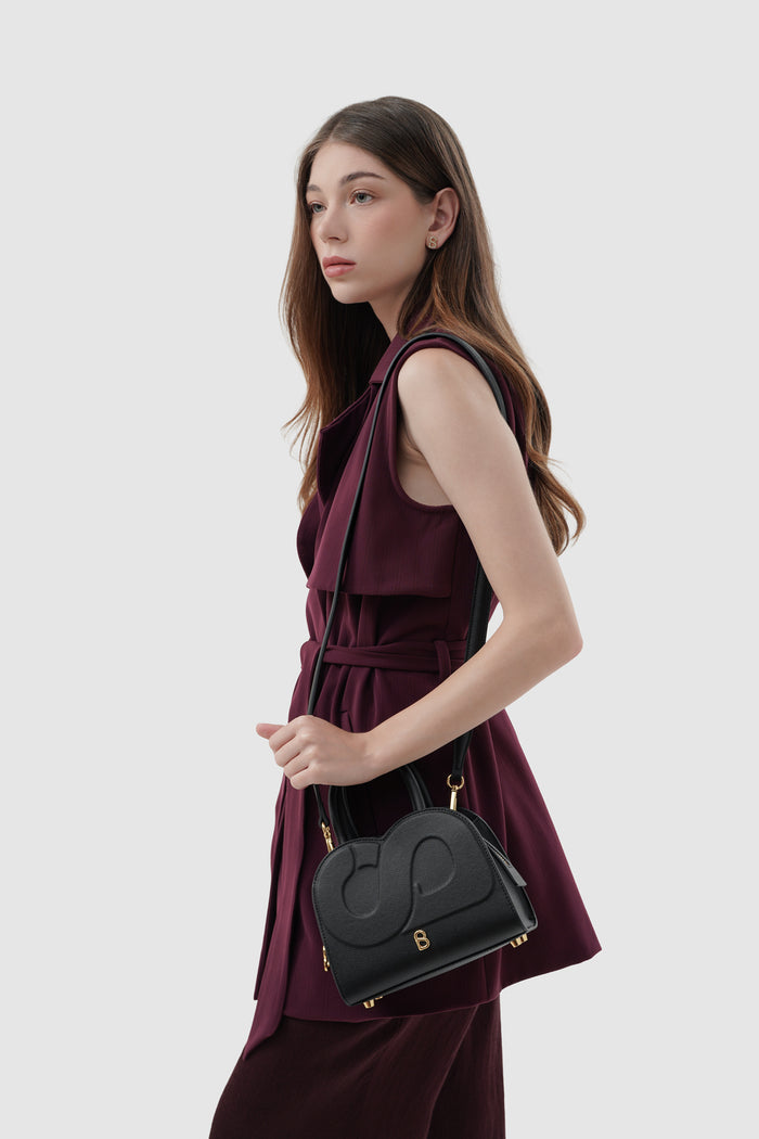 joy bag small with saffiano leather in black by buttonscarves carried on shoulder