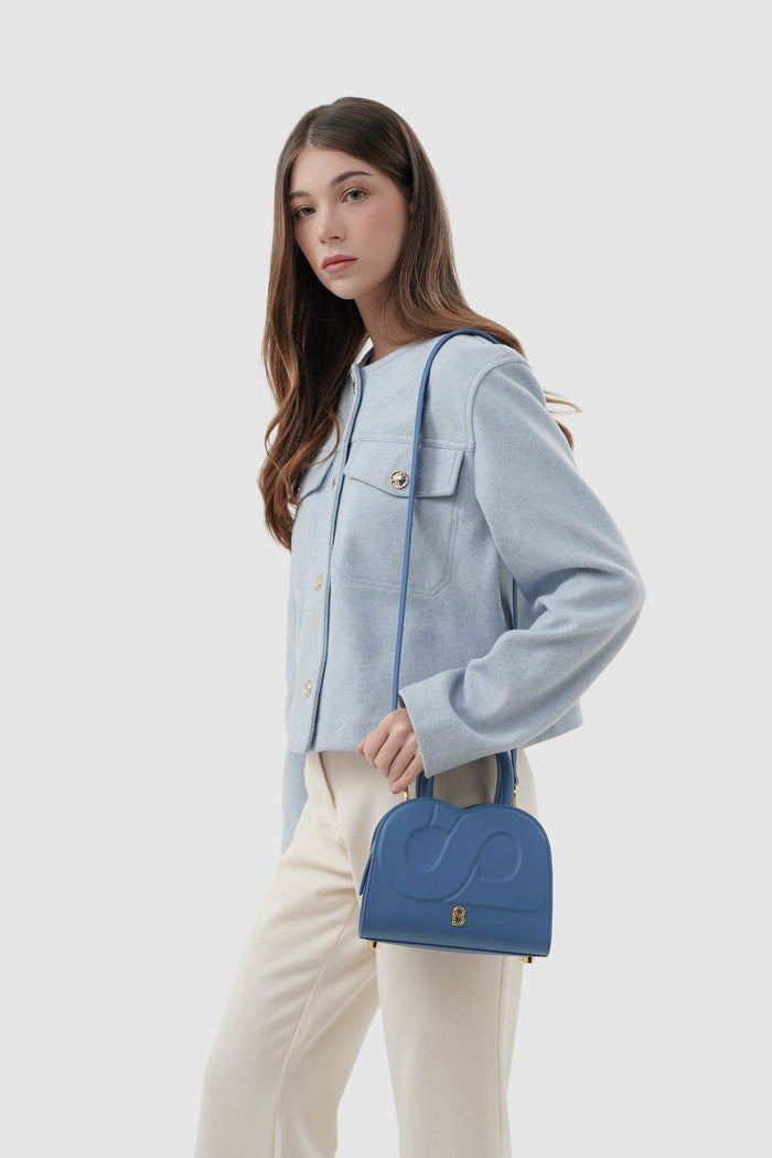 joy bag small with saffiano leather in bluebell by buttonscarves carried on shoulder