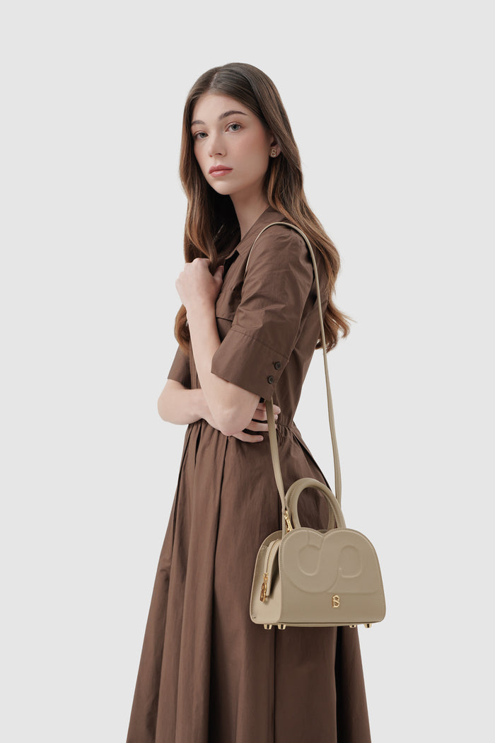 joy bag small with saffiano leather in clay by buttonscarves carried on shoulder