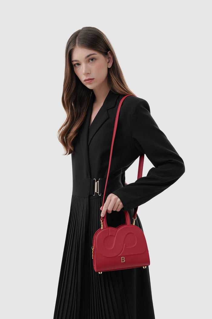 joy bag small with saffiano leather in lacca by buttonscarves carried on shoulder