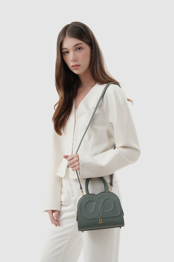 joy bag small with saffiano leather in loden by buttonscarves carried on shoulder