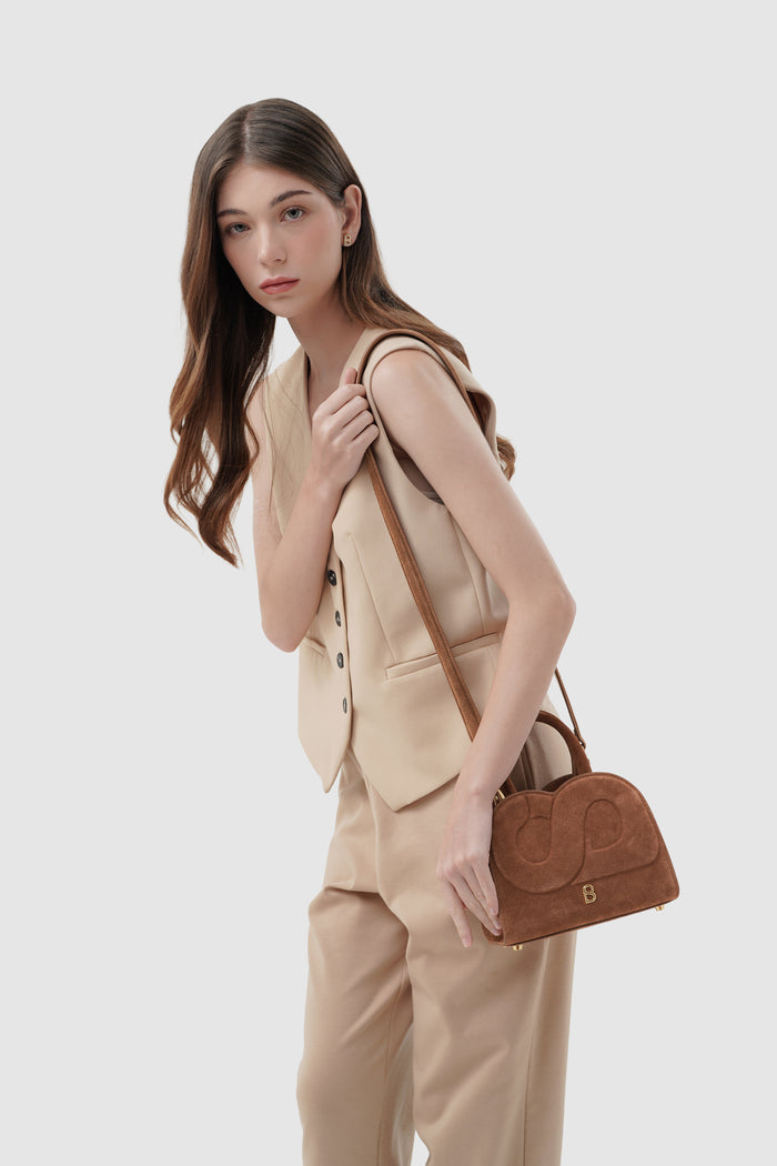 joy bag small with suede leather in caramel by buttonscarves carried on shoulder