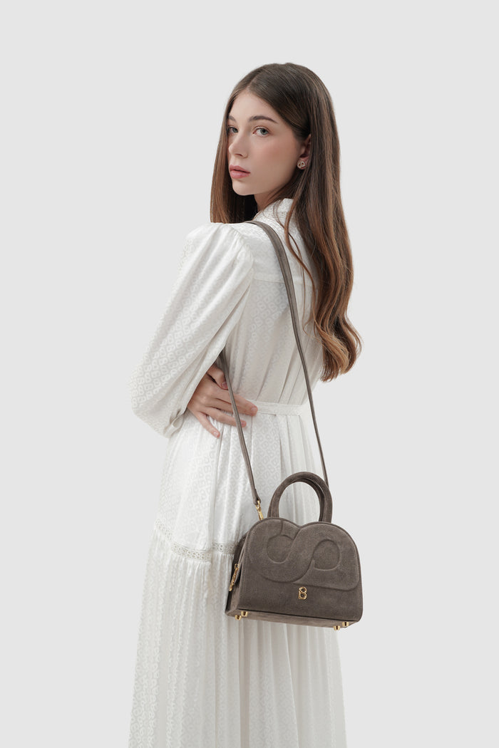 joy bag small with suede leather in taupe by buttonscarves carried on shoulder