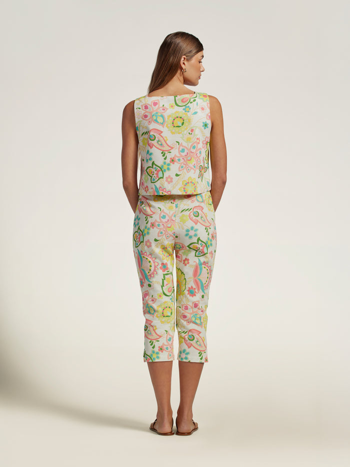 Pastel floral-print capri pants and blue patterned cropped top, back view.