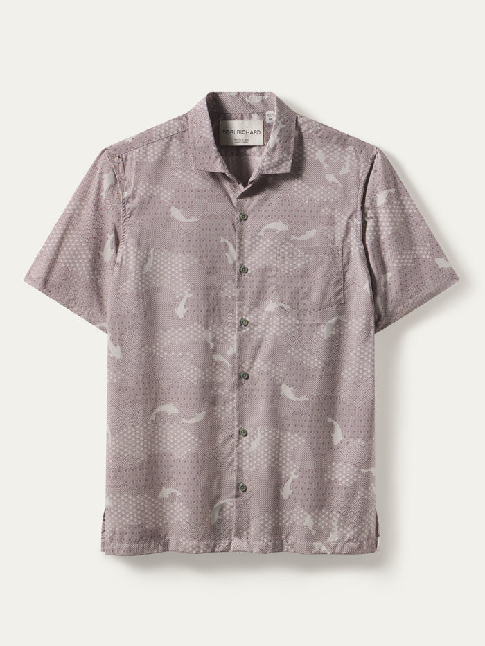Light purple geometric and whale-print cotton shirt with classic collar and front pocket, flat lay front view.