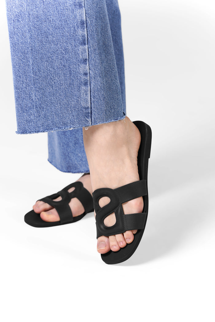 kefi slide sandal in black by buttonscarves worn on feet