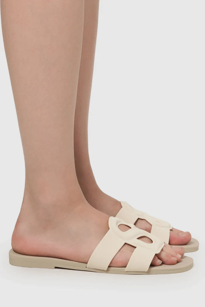 kefi slide sandal in grey cream by buttonscarves worn on feet side view