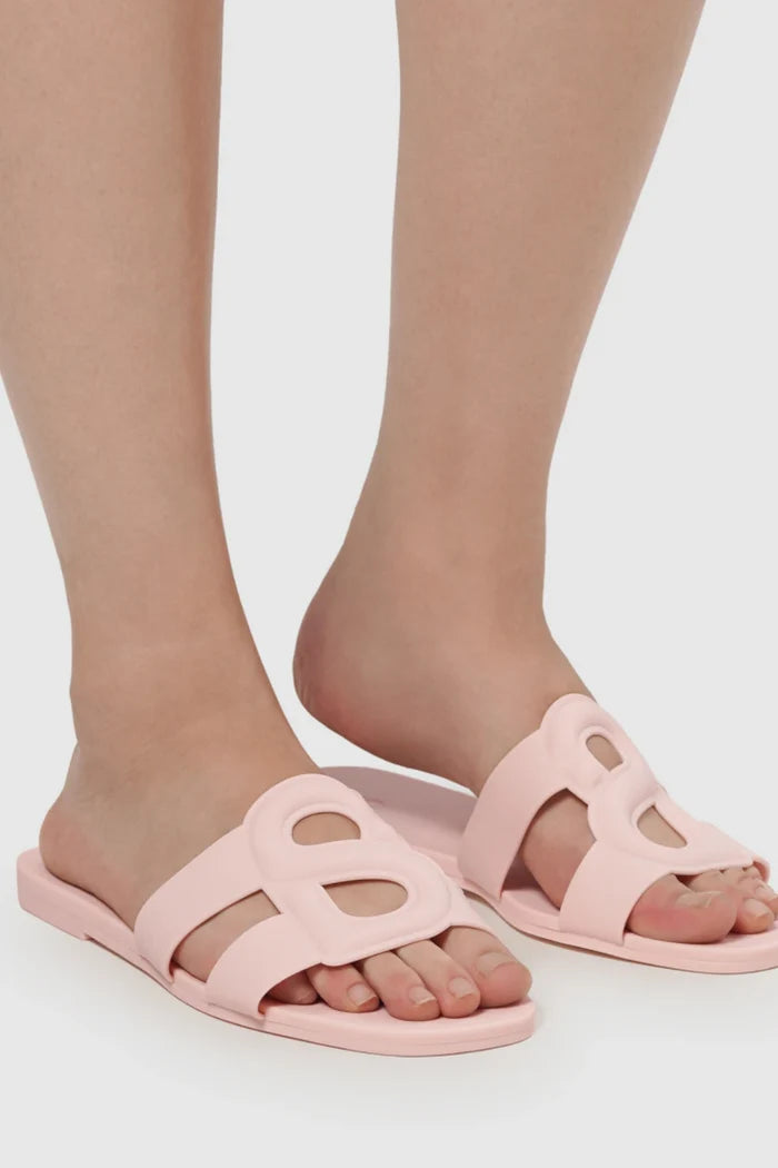 kefi slide sandal in pink by buttonscarves worn on feet