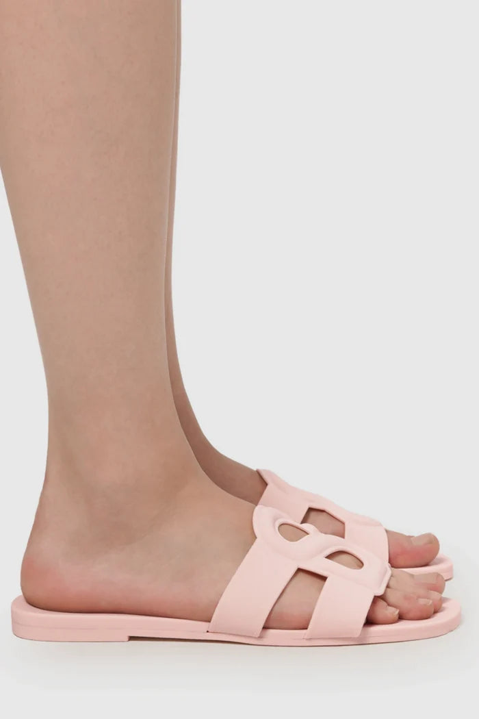 kefi slide sandal in pink by buttonscarves side view worn on feet