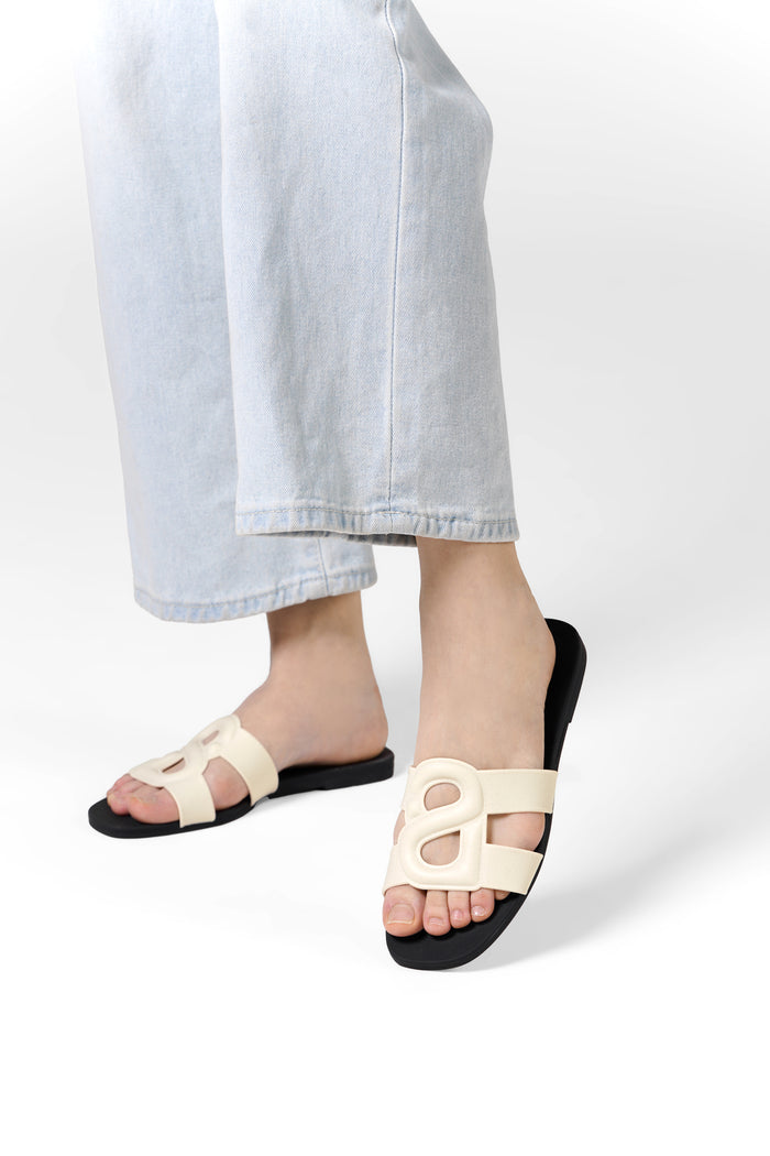 kefi slide sandal in white black by buttonscarves worn on feet