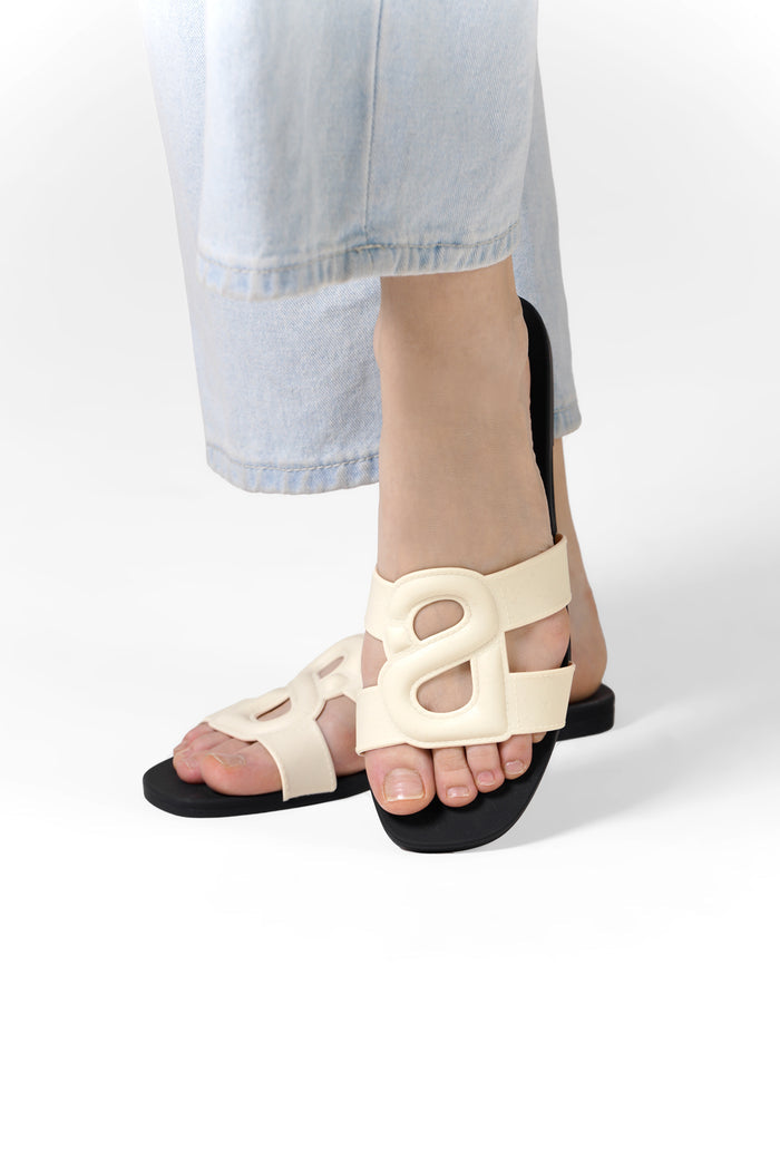 kefi slide sandal in white black by buttonscarves worn on feet