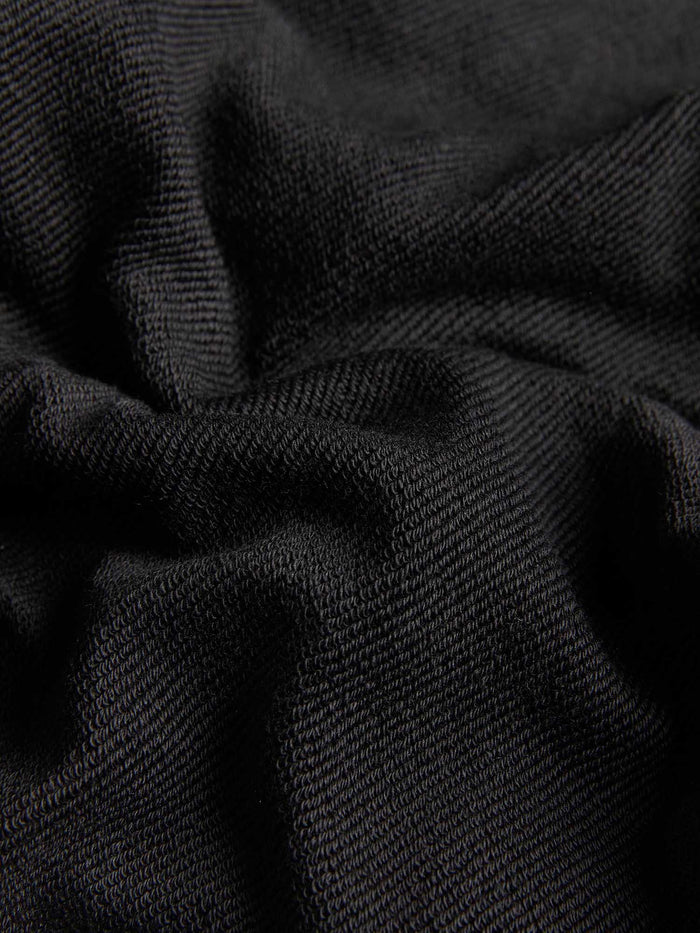 Black Kids' 365 Midweight Hoodie, 320 GSM organic cotton fabric detail. Soft, durable texture for year-round wear