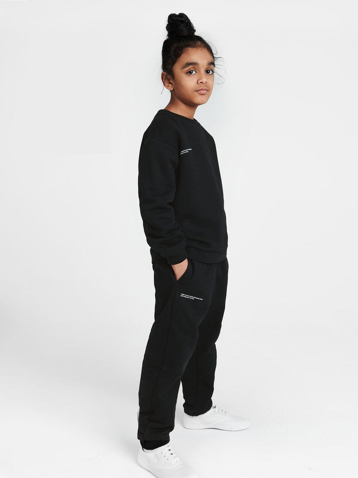 Kids' 365 black midweight organic cotton oversized genderless crew neck sweatshirt on model